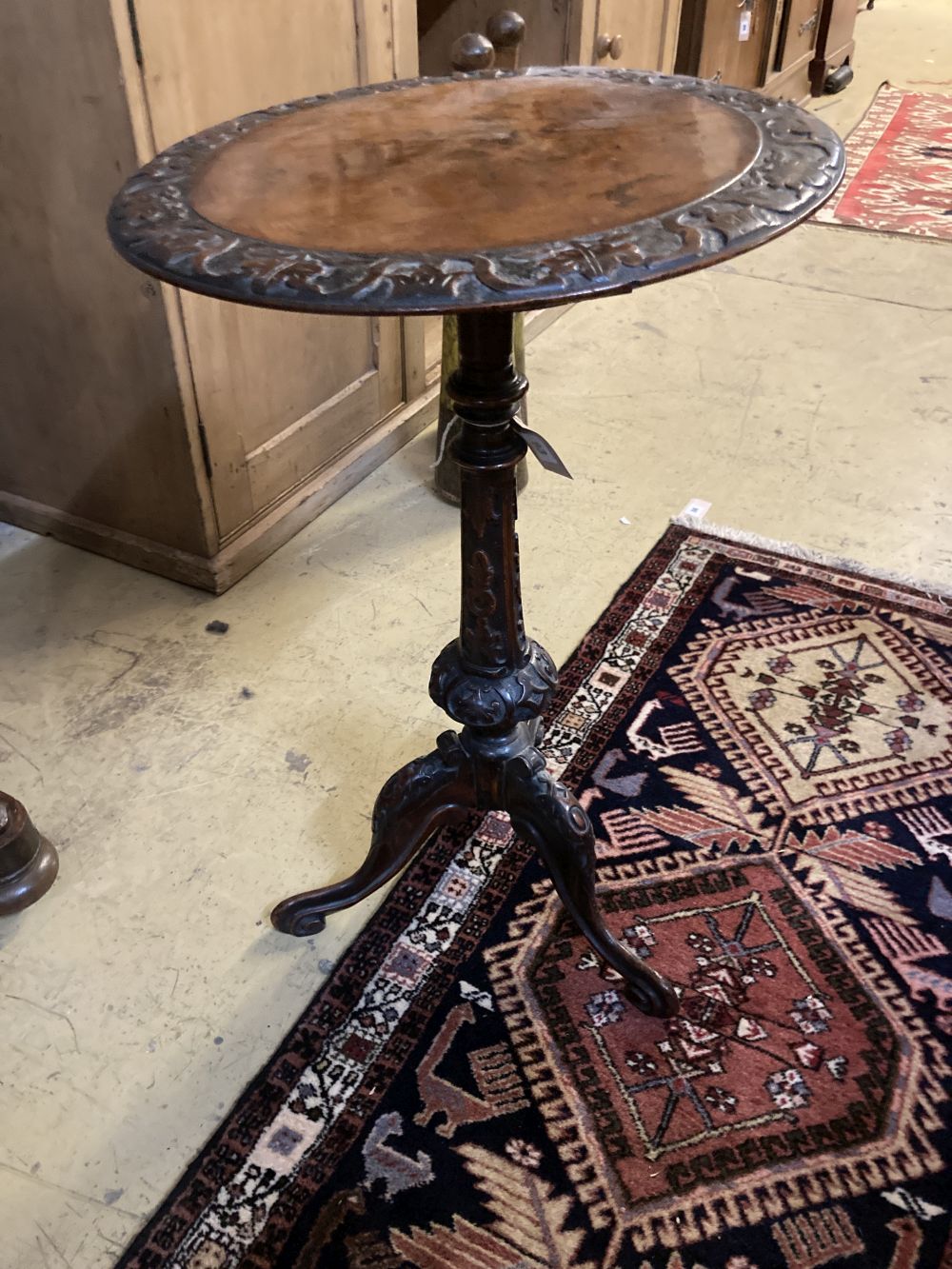 A Victorian carved walnut tripod wine table, diameter 44cm height 72cm